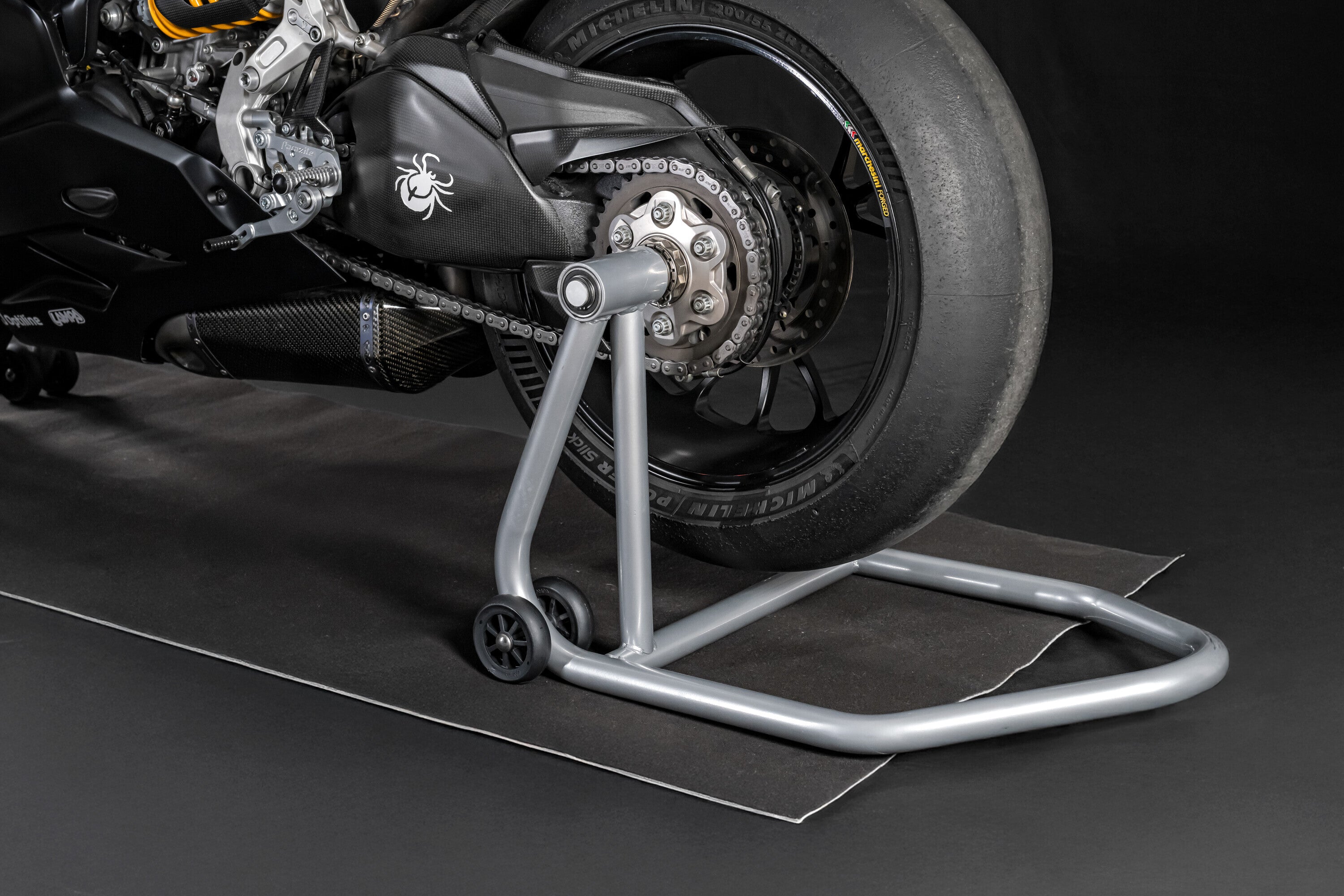 Cavalletto posteriore per moto, monobraccio sinistro